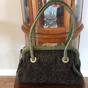 Tweed leather handbag with gold hardware.